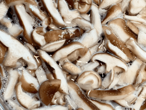 closeup of simmering mushrooms for mushroom broth for dogs