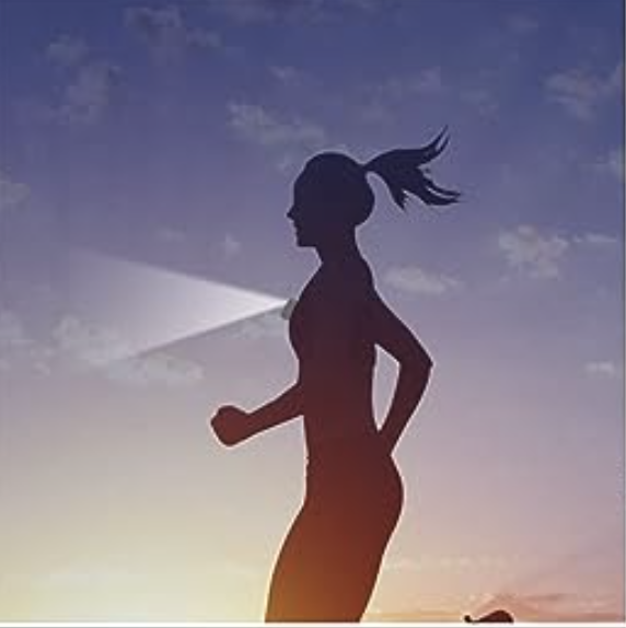 Vector silhouette of woman running at dusk wearing a flashlight/lamp