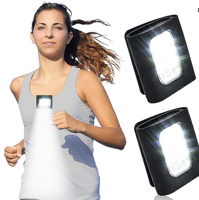 Young female runner in white tank wearing magnetic clip-on rechargeable flashlight