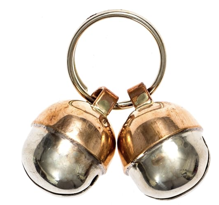 Product photo of copper bells for pet collar on white background