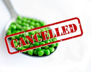 Spoonful of peas with red 'cancelled' stamp over it
